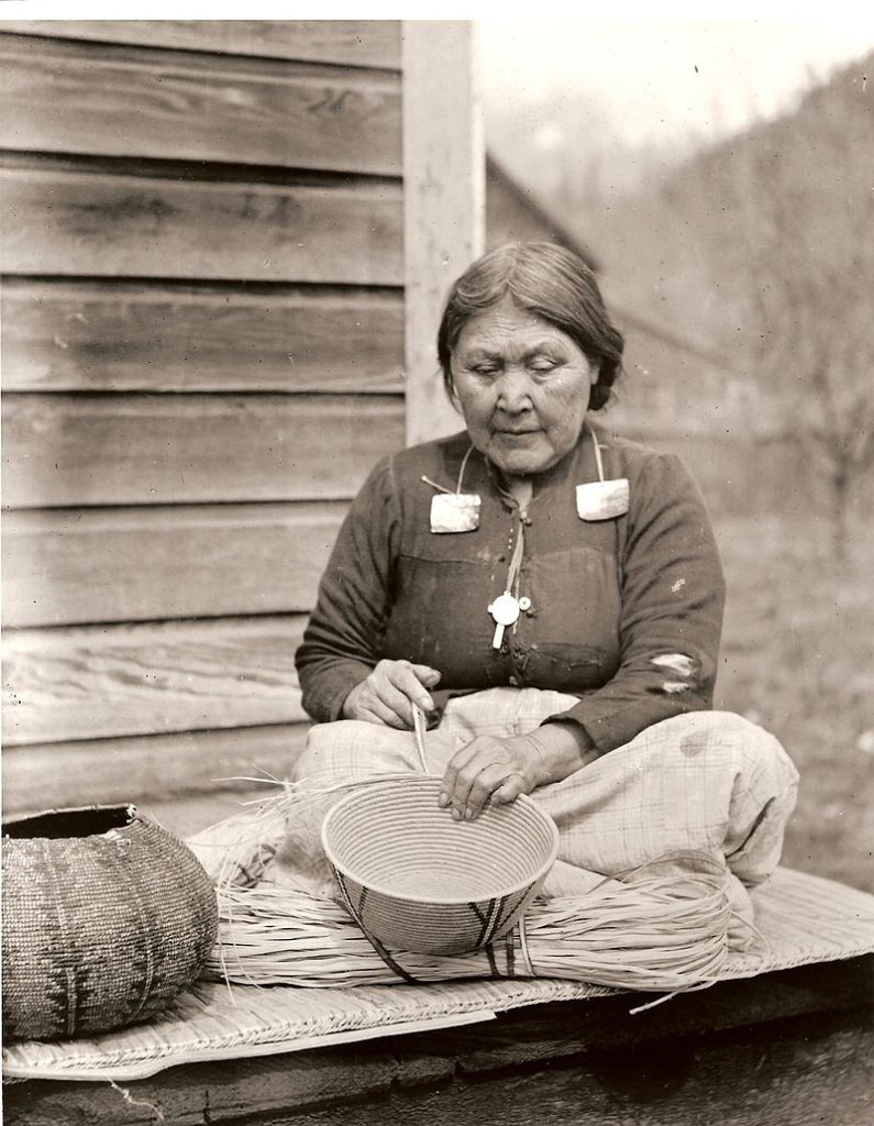 Stó:lō woman with a cedar basket. Image: Wikipedia [Royal British Columbia Museum - PN996]