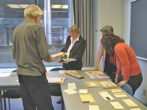 VHS President Paul Flucke (left) and invited guests examine the contents of the chest