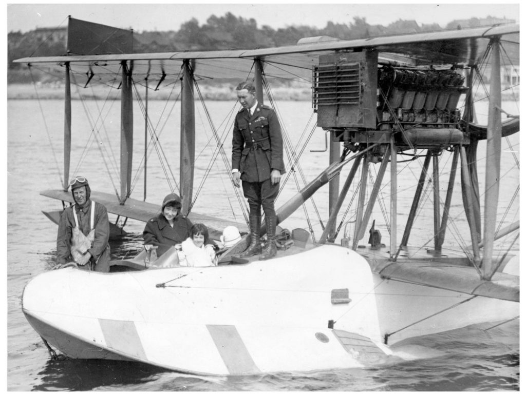 Othoa Scott, the little girl in the cockpit, arriving at English Bay on a flying boat from Hornby Island in 1920.